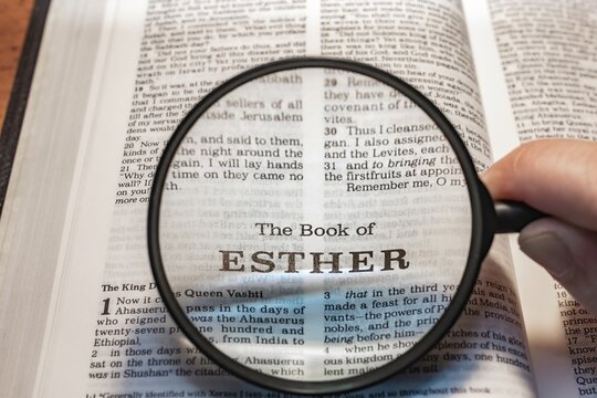 title page book of esther close up using magnifying glass in the bible or Torah for faith, christian, hebrew, israelite, history, religion, christianity, Old Testament