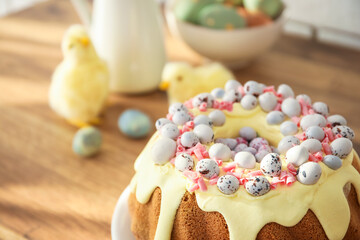 Easter cake with painted eggs on kitchen counter, closeup