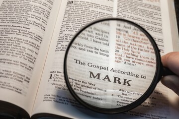 title page book of Mark close up using magnifying glass in the bible for faith, christian, hebrew, israelite, history, religion, christianity, new testament - obrazy, fototapety, plakaty
