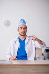Young male doctor working in the clinic