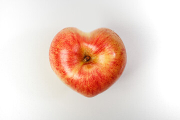 Heart shaped apple isolated on white background.