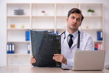 Young male doctor radiologist working in the clinic