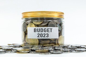 Budget 2023 label on coin jar with white background