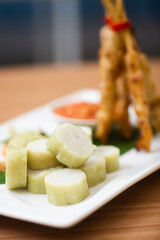 Indonesian grilled chicken satay served with condiments