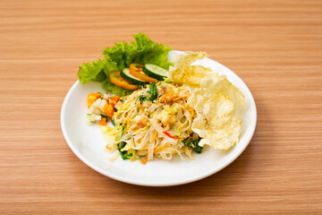 A Plate of vegetable salad served with indonesian crisps
