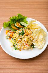 A Plate of vegetable salad served with indonesian crisps