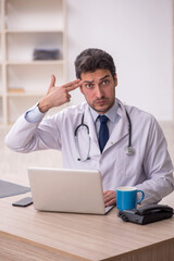Young male doctor working in the clinic