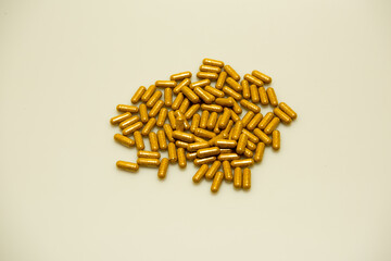Turmeric supplement capsules isolated against a white background. 