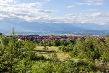 Beautiful Bansko town and Rila national park mountains on background.