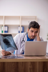 Fototapeta premium Young male doctor radiologist working in the clinic