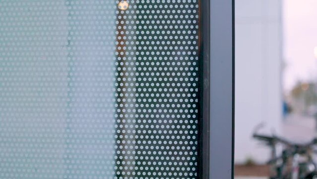 close up detail of ceramic dot frit pattern on glass window. architecture and construction