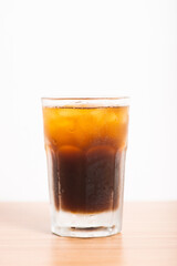 A Glass of iced americano served with ice