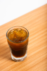 A Glass of iced americano served with ice