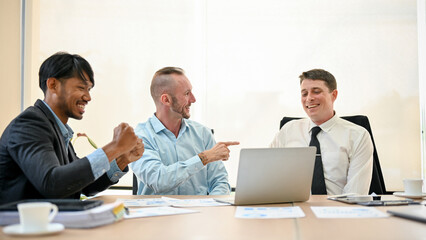 Fototapeta premium Financial team is in the meeting, feeling pleased with their business's current financial situation