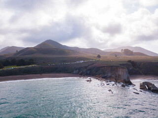 Views while hiking in Montana de Oro State Park. Some of those views are the rocky coastline, bluffs, birds, like seagulls and cormorants, breaking waves, pacific ocean, large trees, rolling hills
