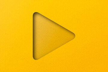 yellow paper cut into holes Triangular shapes are overlaid with light and shadow.