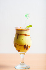 Avocado smoothie served with a mint leaf as garnish