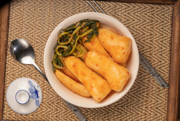 Naklejka na ściany i meble Bachelor kimchi or Radish kimchi with Ponytail radish Korean traditional fermented vegetable a side dish at meals.