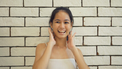 Fototapeta na wymiar Portrait of happy smiling business, Asian Thai woman girl dancing, people lifestyle. Entertainment