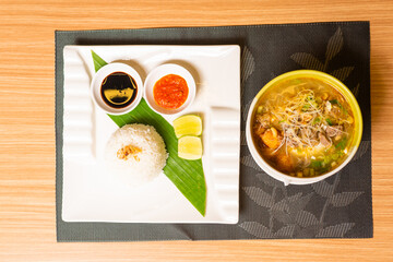 A Plate of Indonesian Dish, Served with Rice Soto Ayam