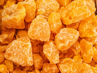 Yellow and orange background of various incense and incense stone material on the market