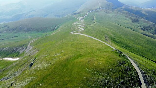 Aerial drone footage of a Romanian mountain road &ndash; Transalpina. It is a 148 km national road located in the Southern Carpathians of Romania and is one of the highest roads of the Carpathian Mountains.