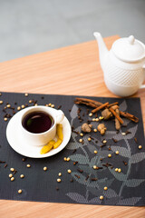 A cup of hot tea brewed with cinnamon and ginger