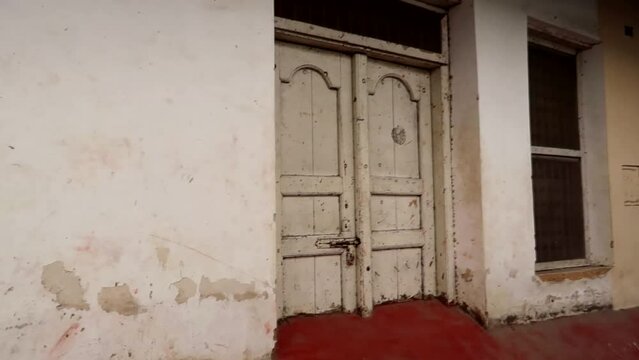 Old and white typical Zanzibar door in the old town of Stone Town known as Mji Mkongwe