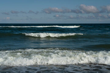 View of the incoming wave on the Baltic Sea on the shore of the Curonian Spit on a summer day, Kaliningrad region, Russia