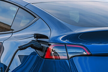 Charging electric car, close-up