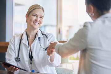 Handshake, healthcare or trust with a doctor woman and patient in a hospital for a checkup or...