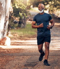 Music earphones, running and black man in nature for health, wellness and fitness. Radio, podcast...