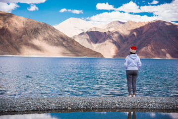 Fototapeta na wymiar Happy Girl travel to Pangong lake, Leh Ladakh, India