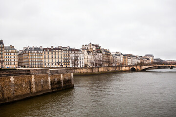 Fototapeta na wymiar Buildings in Paris, France along the Seine River in winter.