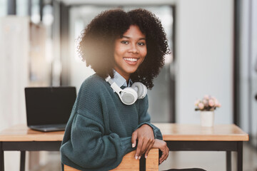 Young black African woman university student learning online using laptop computer. Smiling girl watch webinar or virtual education.