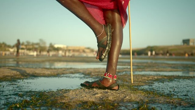 Legs Of Masai Warrior Guarding And Standing On The Beach In Watamu, Kenya. - close up