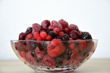 frozen fresh berries in a glass bowl