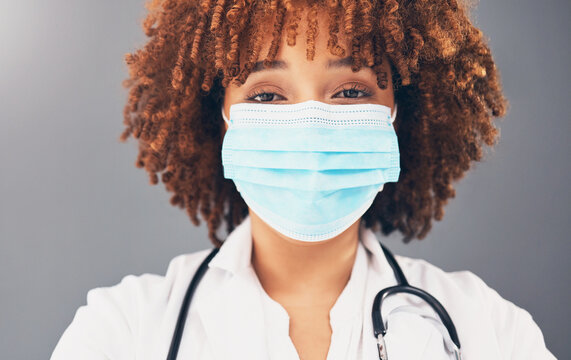 Portrait, Healthcare And Black Woman With Mask, Wellness And Protection Against Grey Studio Background. Face Cover, African American Female Doctor And Medical Professional With Safety Regulations