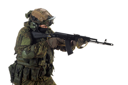 A russian mercenary soldier with AK-74 in his hand and aiming in enemy.