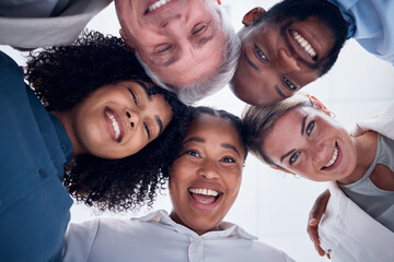 Obraz premium Portrait, below and happy business people in group or circle for teamwork, team building and collaboration. Face of diversity employees, worker and professional community smile together in solidarity