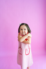 Pretty little girl acting cold and shivering.