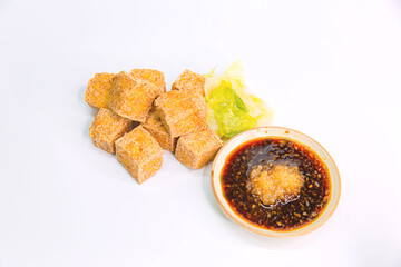 Mouthwatering Asian Fried Tofu Bean Curd Served with Garlic Soy Sauce on an Isolated White Background