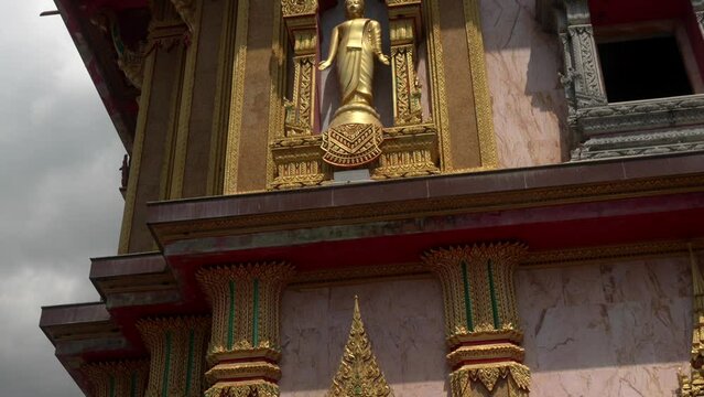 Chalong temple golden buddha statue tilt shot