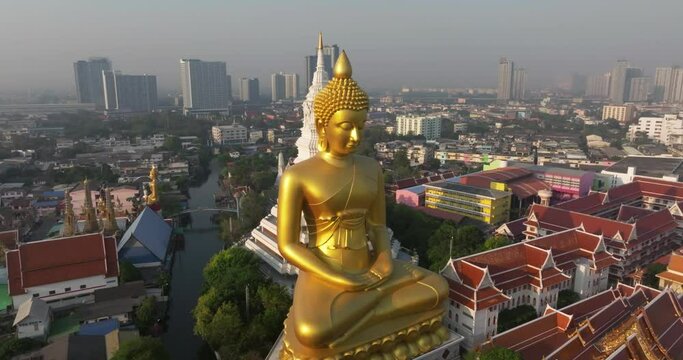 An aerial view of the Giant Buddha and Pagoda at Wat Paknam Phasi Charoen Temple, The most famous tourist attraction in Bangkok, Thailand.