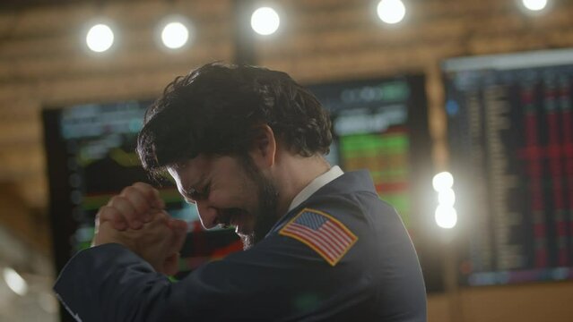 Stock broker extremely happy on the trading floor
