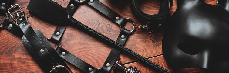 set of sex toys for hard BDSM sex with domination and submission. Panoramic wide horizontal photo...