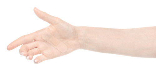 Female caucasian hands with medical adhesive wound plaster  isolated white background. Woman hands with surgical tape showing different gestures. first aid bandage
