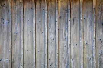 brown natural wooden background planks wall of vertical wood boards on horizontal facade