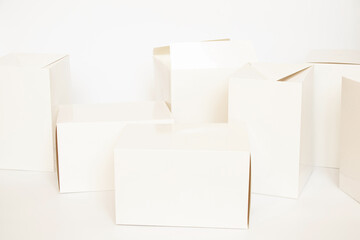 A lot of white empty boxes on a white background, boxes for packaging