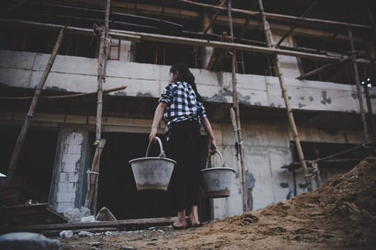Children are forced to work in the construction area. Human rights concepts, stopping child abuse, violence, fear of child labor and human trafficking